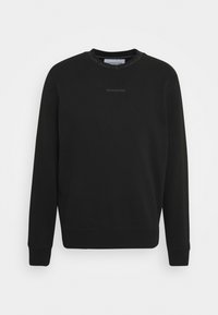 Sweatshirt noir en mélange de coton, avec un col rond côtelé et des poignets côtelés. Branding subtil "CALVIN KLEIN JEANS" sur le devant.