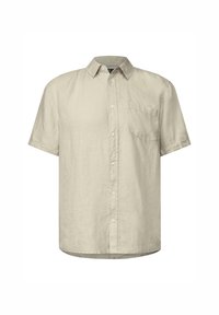 Camisa de manga corta hecha de lino beige claro. Presenta un cierre frontal con botones, cuello y un único bolsillo en el pecho izquierdo. Textura suave.