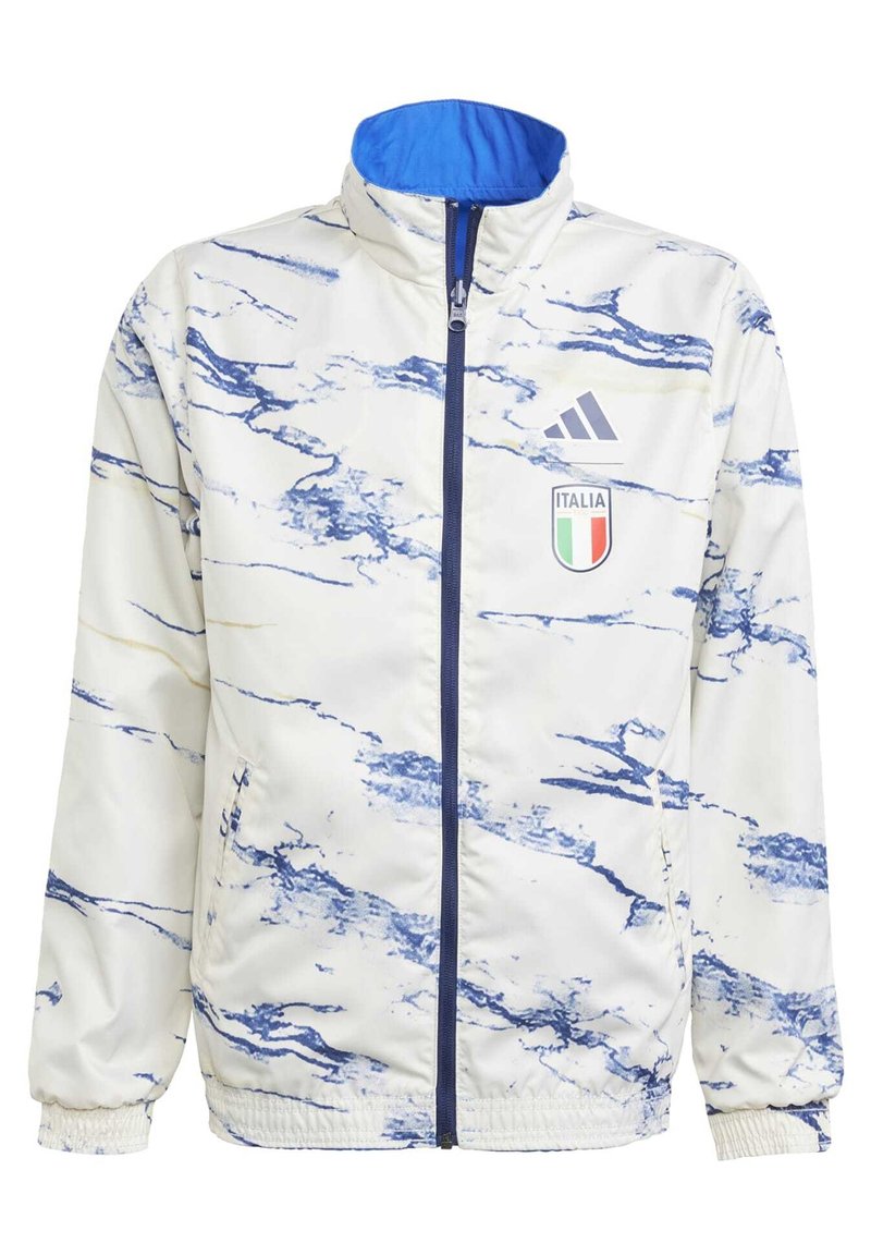 Vit sportjacka med blå marmorering. Har hög krage, frontdragkedja och Italien-logotyp. Materialet är mjukt och lätt.