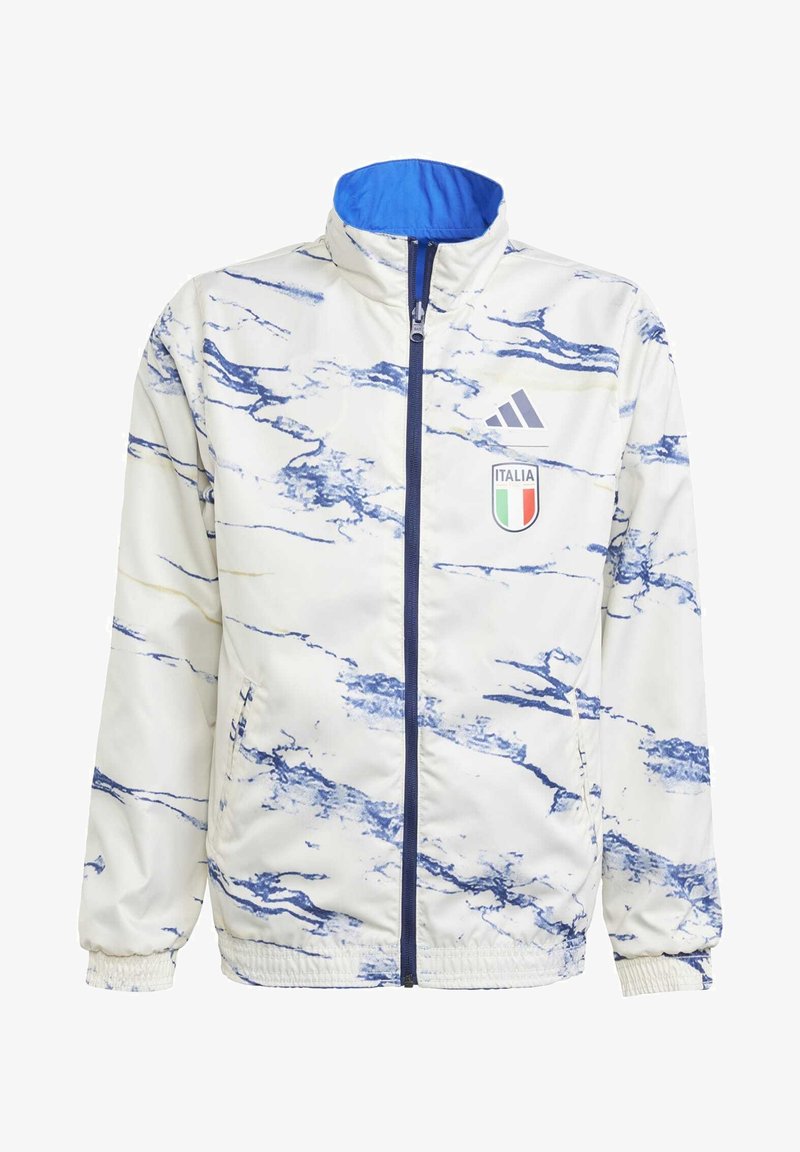 Chaqueta atlética blanca con patrón de mármol azul. Cuenta con un alto cuello, cremallera frontal y el logotipo de Italia. El material es suave y ligero.