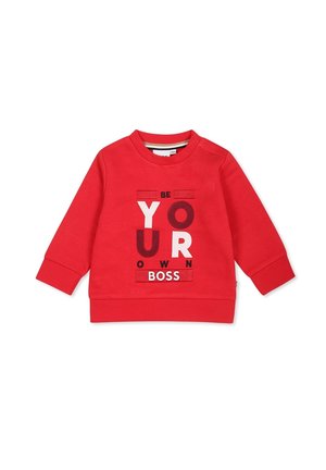 Rød langærmet sweatshirt til småbørn med trykknapper på skulderen, med teksten "Be Your Own Boss" i blandede hvide og mørkerøde bogstaver.