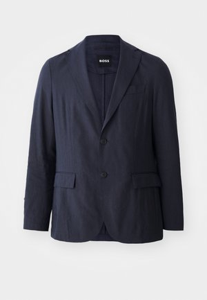 Blazer navy realizzato in tessuto con finitura testurizzata, dotato di rever a punta, due tasche frontali e chiusura a due bottoni. Etichetta del marchio visibile.