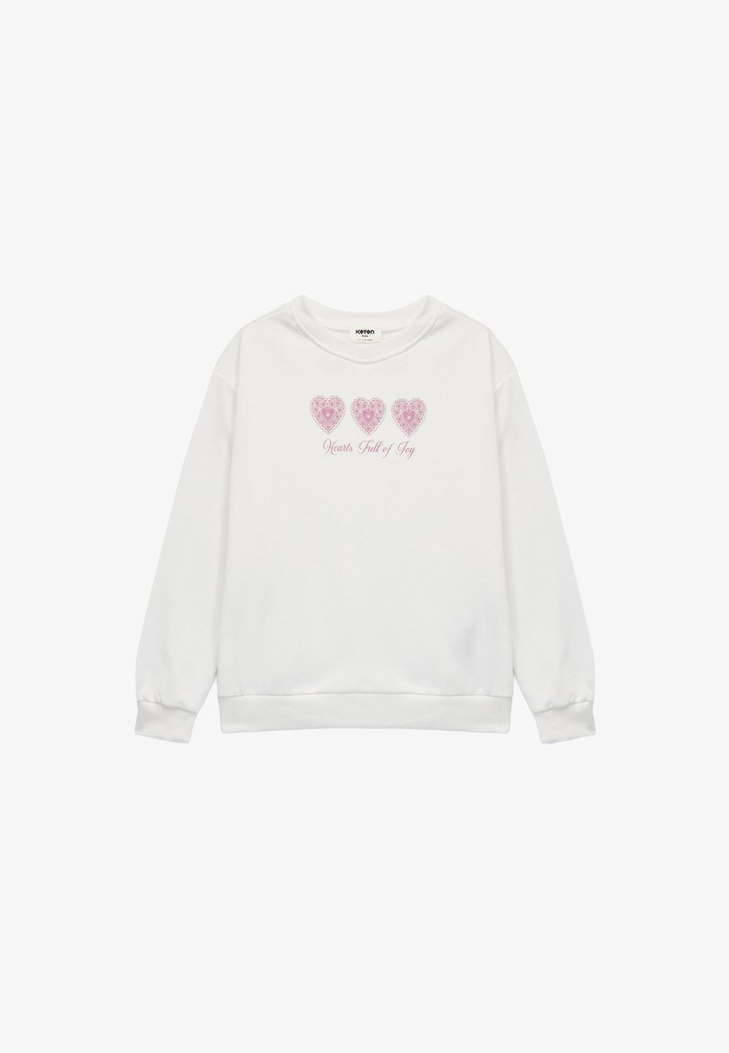 Hvid sweatshirt med lange ærmer, rund halsudskæring, med tre pink hjerte-design og teksten "Hjerter fulde af glæde" nedenfor.