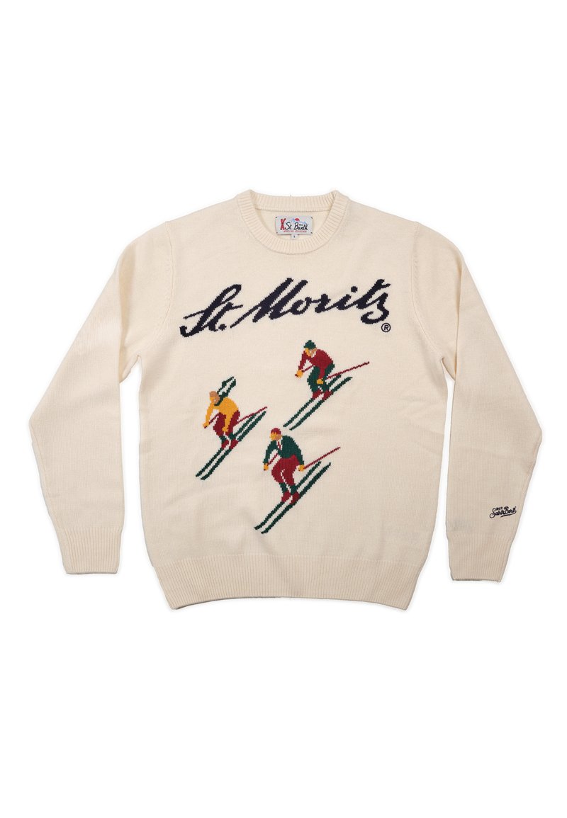 Cremekleurige gebreide trui met een skimotief van vier skiërs in felle kleuren. Logo "St. Moritz" opvallend afgebeeld over de borst.