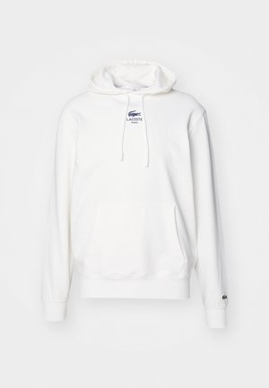 Witte Lacoste hoodie met voorzak, trekkoord in de capuchon en klein logo op de borst en mouwboord.