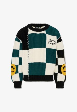 Pull en tricot avec un design en patchwork teal, noir et blanc, accentué de visages souriants jaunes, avec un col et des poignets côtelés, et des bords effilochés.