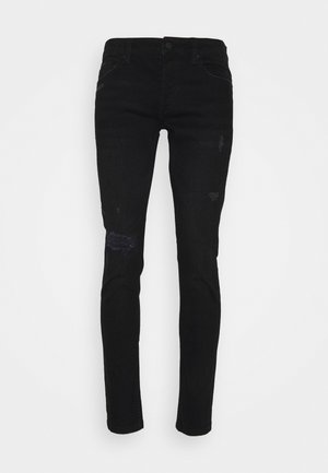 Jeans de mezclilla negra de corte slim, con detalles rasgados en las rodillas y un diseño clásico de cinco bolsillos. Sin logotipos ni adornos visibles.