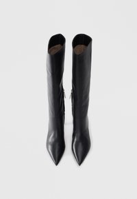 Black leather knee-high boots with a pointed toe and a smooth texture. Features a side zipper and a fitted silhouette.