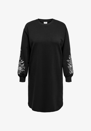 Juoda džemperio suknelė ilgomis rankovėmis, puošta baltais gėlių siuvinėjimais ant rankovių. Pagaminta iš minkštos, tekstūruotos medžiagos.