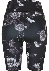 Svarte sykkelshorts med blomstertrykk og høy midje. Har intrikate grå og hvite blomstermønstre, laget av elastisk og glatt stoff.
