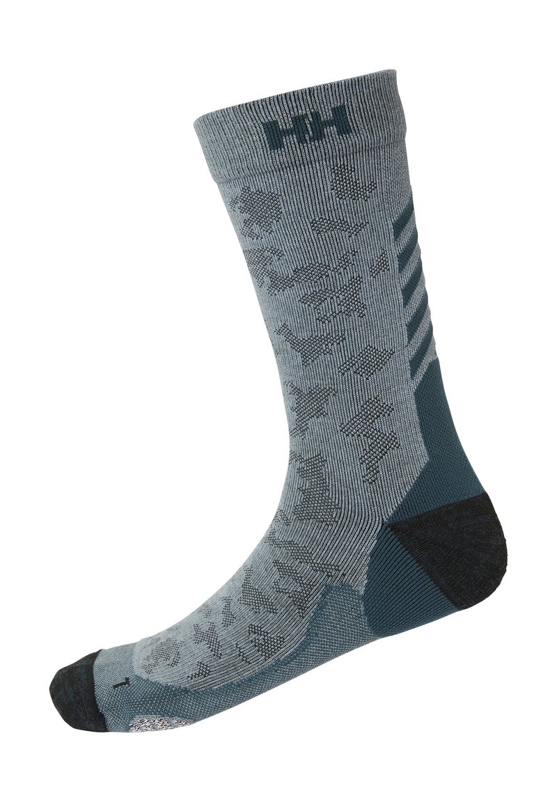 Calcetín gris con patrón azul oscuro, que presenta un diseño texturizado, puño acanalado, talón reforzado y punta reforzada para mayor durabilidad.