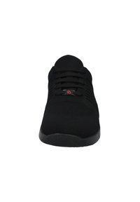 Black athletic shoes with a knitted upper, featuring a lace-up design, textured surface, and a small red logo on the tongue. Flat rubber sole.
