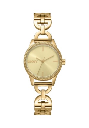 Goudkleurig DKNY-horloge met ronde wijzerplaat, minimalistische urenmarkeringen, schakelen armband en gestructureerde lunette, toont tijd om 7:11:36.