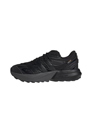 Black athletic shoe with mesh and synthetic upper, zigzag strap design, cushioned midsole, textured outsole, and orange branding detail.