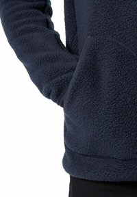 Navy blue fleece pullover with a textured, soft surface; features a front kangaroo pocket and ribbed cuffs. Seamless design at the hem.