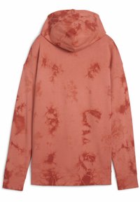 Mikina s kapucňou v koralovej farbe s efektným tie-dye vzorom. Má dlhé rukávy, voľný strih a rebrované manžety. Vyrobená z mäkkej bavlny.