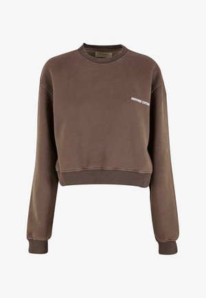 Hnědá krátká mikina z měkké látky. Má dlouhé rukávy a kulatý výstřih. Na přední straně je potisk s nápisem "ANOTHER COTTON".