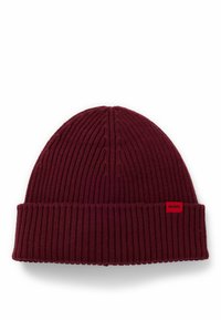 Burgundy-knitted pipo, jossa on ribbikuvio, käännettävä reunus ja pieni punainen logotaga sivulla.