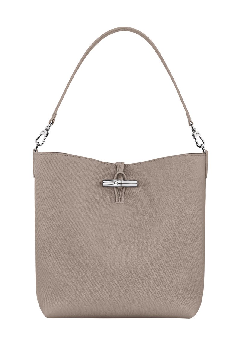 Beige Lederhandtasche mit glatter Textur, oberer Magnetverschluss und einem einzigen Schultergurt. Verfügt über silberne Hardware-Akzente.
