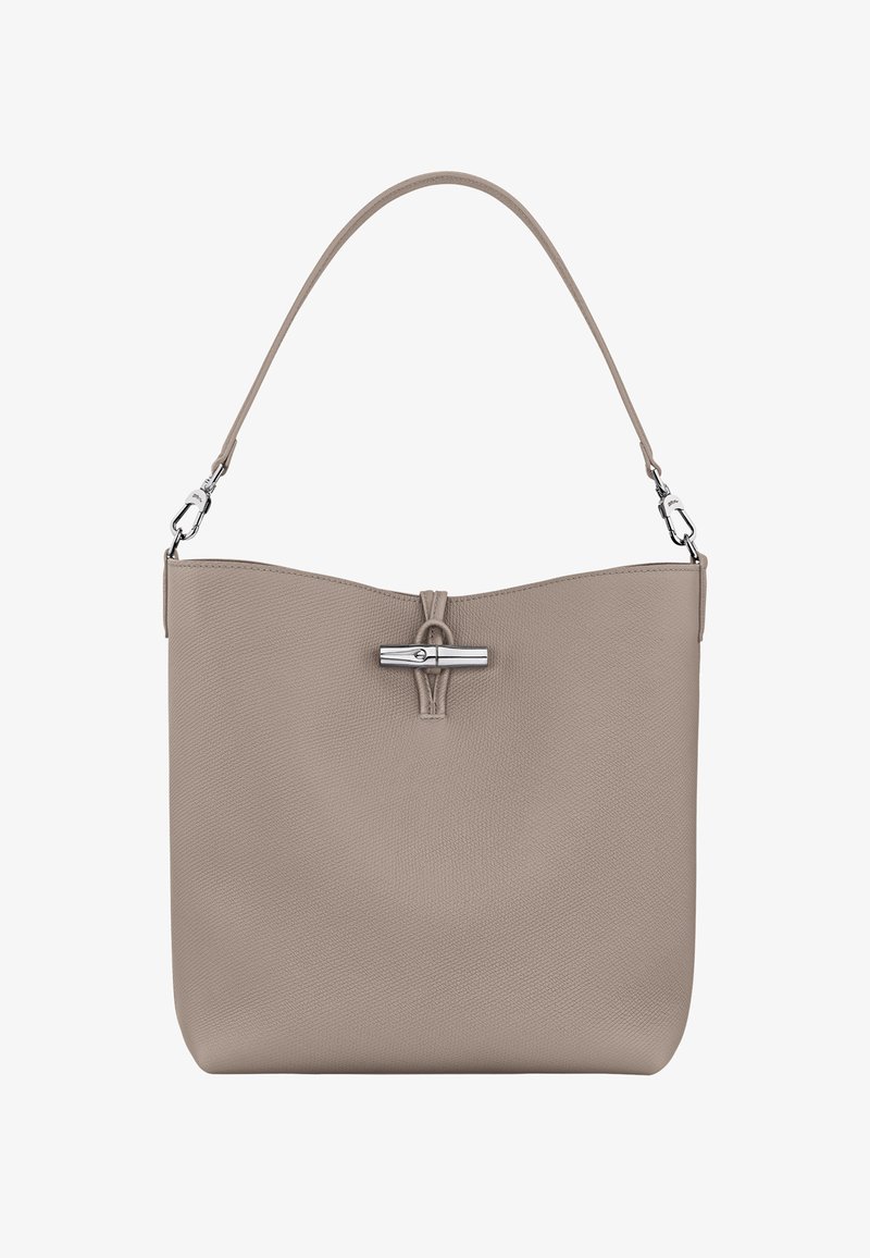 Beige Lederhandtasche mit glatter Textur, oberer Magnetverschluss und einem einzigen Schultergurt. Verfügt über silberne Hardware-Akzente.