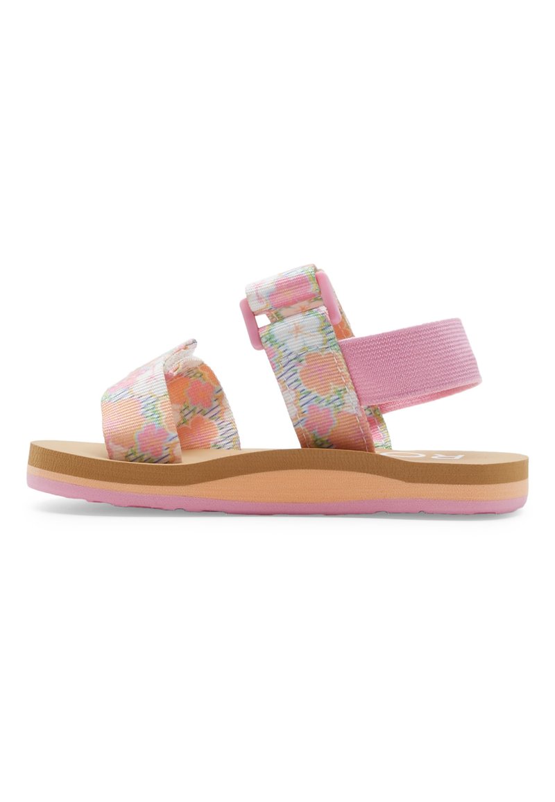 Sandal dengan pola bunga, tali berwarna pink dan krim, pengencang yang dapat disesuaikan, serta sol tekstur coklat muda dengan aksen pink.