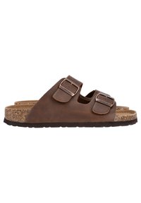 Sandale à glissière en cuir marron avec deux sangles réglables, semelle en liège et semelle en caoutchouc texturée. Design minimaliste sans embellissements supplémentaires.
