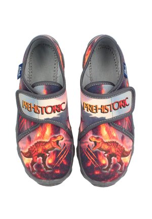 Textilschuhe mit einem lebhaften Dinosaurierdruck in Rot und Orange auf einem dunklen Hintergrund. Verstellbarer Riemen mit dem Etikett "PRÄHISTORISCH".