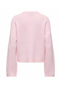 Cropped sweater in soft pink fabric, featuring long sleeves and a rounded neckline. Textured surface with a ribbed hem. No patterns or embellishments.
