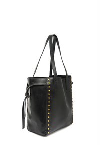 Black leather tote bag with flat handles, featuring gold studs along the side, and a knotted accent detail on one side.