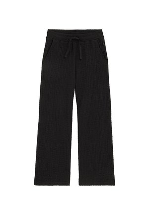 Čierne široké nohavice s textúrou, elastickým pásom a šnúrkou na stiahnutie, s bočnými vreckami, položene na bielom pozadí.