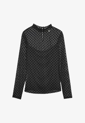 Top negro de manga larga con un patrón de lunares texturizados, cuello alto y cierre en la espalda con ojal. Hecho de una tela ligera y transparente.