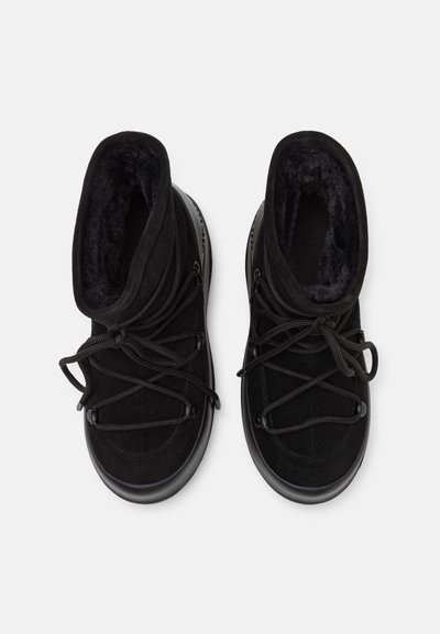 Black mid-top boots made of suede and synthetic material, featuring a plush interior, round laces, and a textured rubber sole.