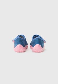 Blue fabric shoes with a soft pink textured sole and heel. Features a contrasting blue interior and a back strap for easy wear.