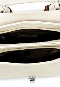 Beige leather handbag with a smooth texture, featuring three zippered compartments and a silver clasp. Interior lined with brown fabric.
