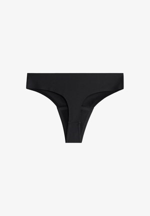 Musta stringi alusvaate, joka on valmistettu sileästä materiaalista ja jossa on minimalistinen muotoilu, ohut sivuosa ja matala vyötärö.