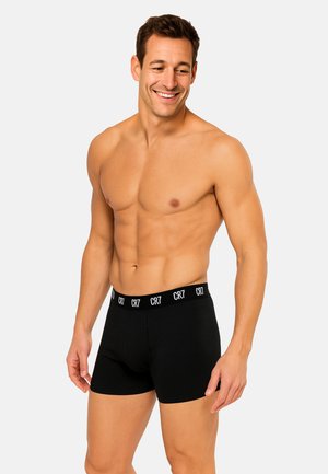 Boxer neri con vita elastica con il logo CR7 bianco. Realizzati in tessuto morbido, progettati per comfort e vestibilità.