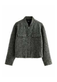 Hallhalline tweed jakk, lühenen lõikega, kahe eesmise taskuga, ümarate kraega ja nööbiga kinnitustega. Tekstuuriga kangas, millel on kalasabamuster.