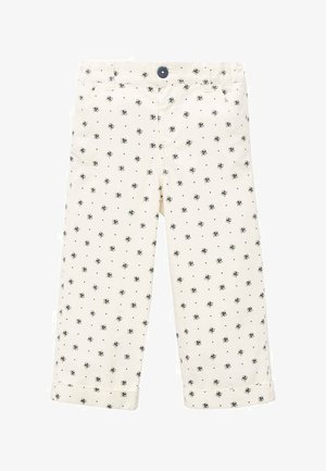 Kremaste otroške hlače z majhnimi mornarsko modrimi cvetličnimi vzorci in obrnjenimi robovi, ki imajo temno gumbasto zapiranje na pasu.