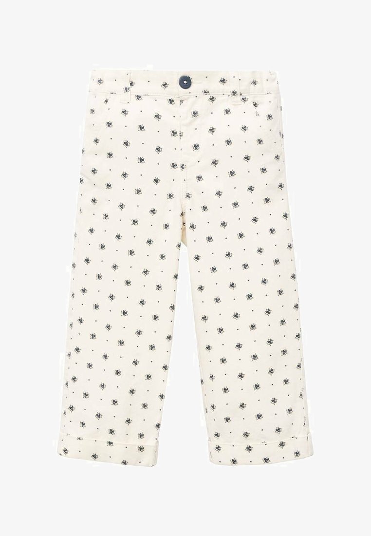 Kremaste otroške hlače z majhnimi mornarsko modrimi cvetličnimi vzorci in obrnjenimi robovi, ki imajo temno gumbasto zapiranje na pasu.