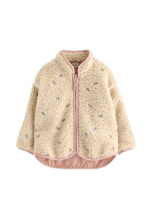 Giacca in pile crema con bordo rosa, piccolo ricamo floreale, zip frontale e orlo stondato asimmetrico.