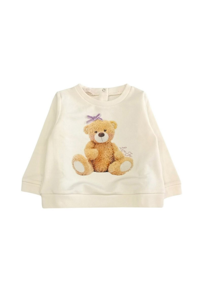 Felpa color crema con grafiche di un teddy bear peluche, con pelliccia marrone e un fiocco viola, scollatura rotonda e maniche lunghe.