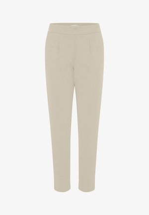 Beige pants made of soft fabric, featuring a smooth texture, tapered legs, and side pleats, with an elastic waistband for comfort.