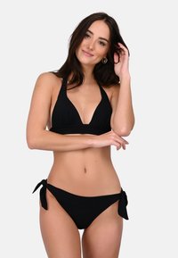 Black bikini set featuring a triangular top with halter neck ties and low-rise bottoms with side ties, made from smooth, stretch fabric.