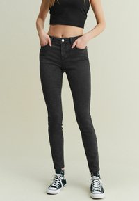 Next - LOW RISE STANDARD - Oprijete (skinny) kavbojke - washed black Miniaturna slika 1