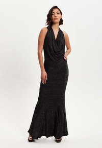 Black, fitted halter neck dress with draped cowl neckline, flared skirt, and subtle shimmer texture. Stretches from top to hemline.