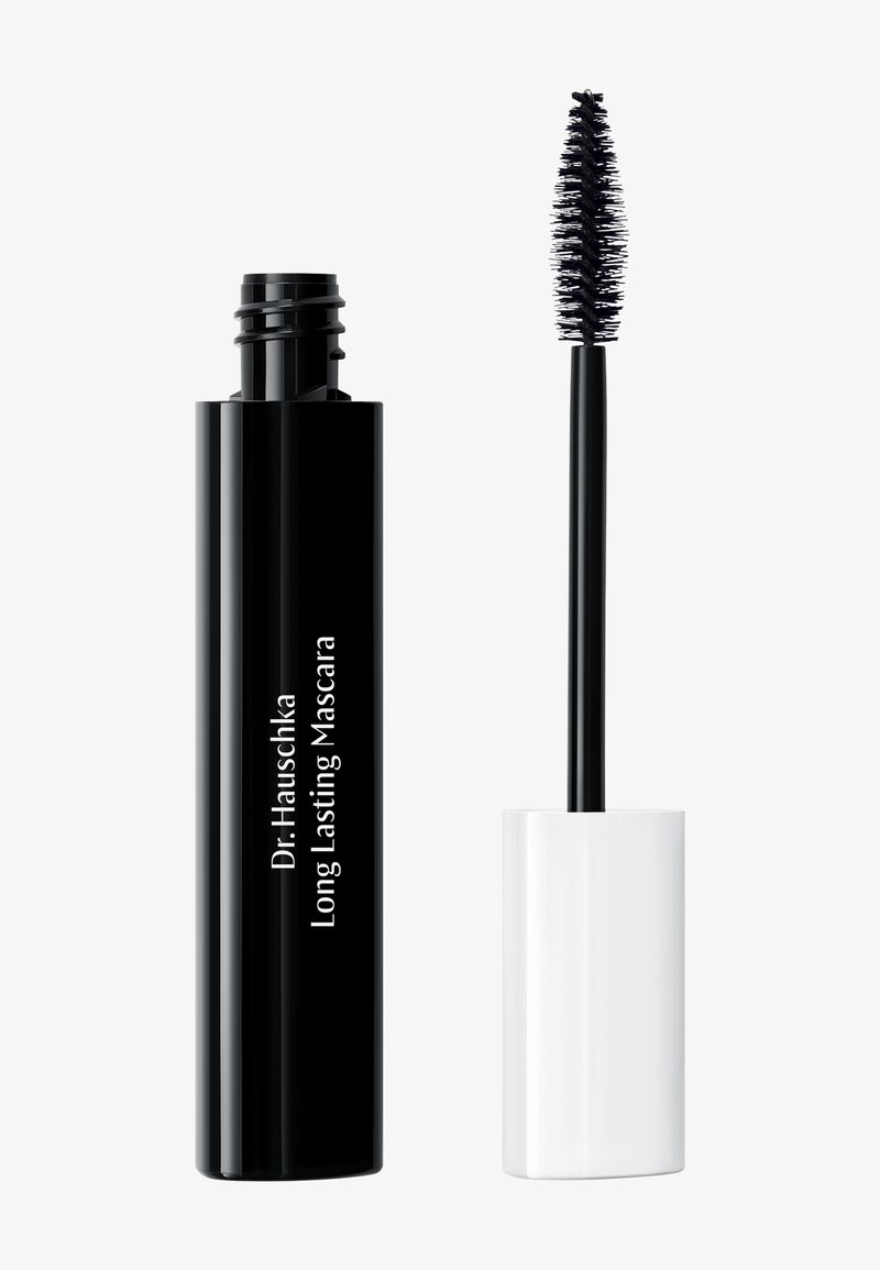 Black cylindrical mascara tube with white cap, features printed text. The brush is long, with thick bristles for application.
