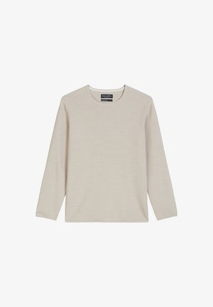 Lichtbeige langemouwen shirt met een ronde halslijn, textuurstof en een losse pasvorm. Etiket zichtbaar aan de hals met merknnaam.