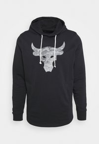 Felpa nera con cappuccio, dotata di laccetti bianchi e una grande grafica di teschio di toro grigio sul petto, caratterizzata da tasche frontali e maniche lunghe.