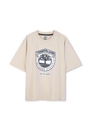 Beige short-sleeve T-shirt made from cotton, featuring a large black printed Timberland logo with a tree design and "Crafted Goods."