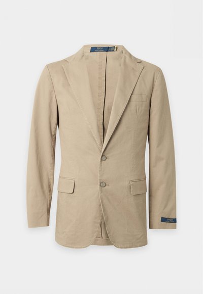 Beige blazer med to knapper, hakkede revers, forlommer med klap, brystlomme og Polo Ralph Lauren-mærke på ærmet og indersiden af kraven.